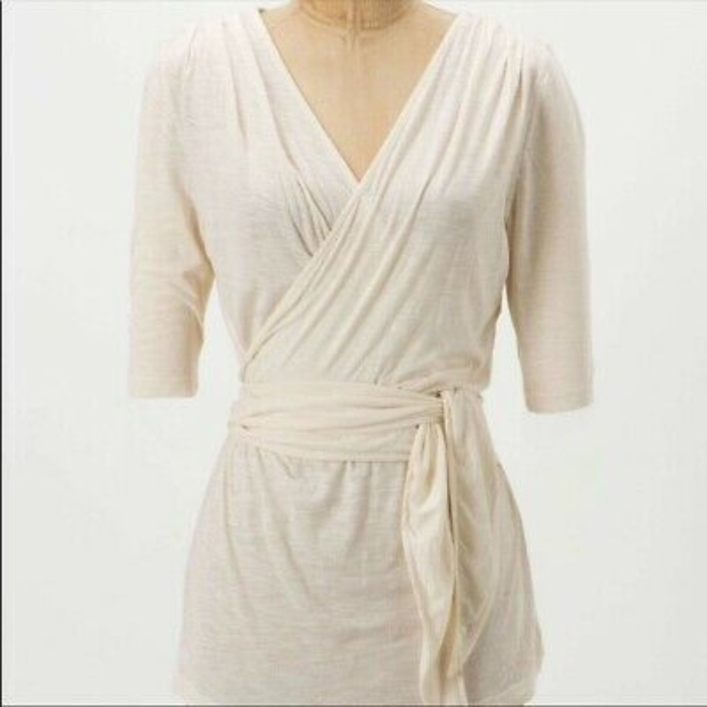 Anthropologie wrap top with embroidered back panel